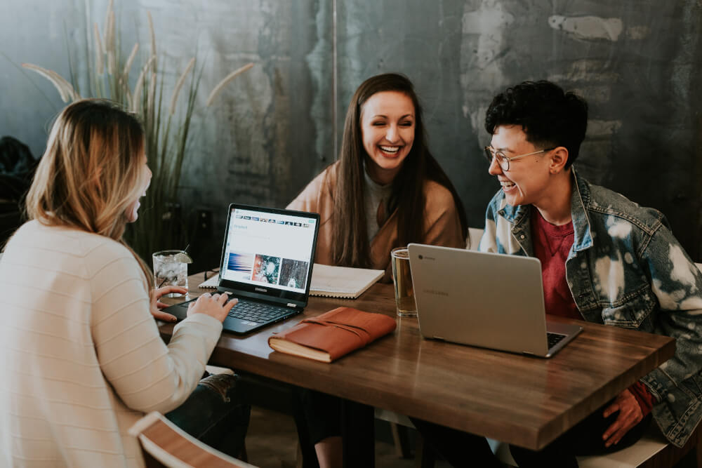 Three ladies discussing their UX careers